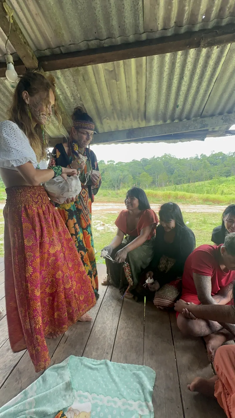 Maisie sharing reusable menstrual cups with women in the village
