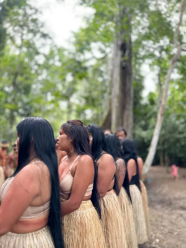 Women standing together in the forest