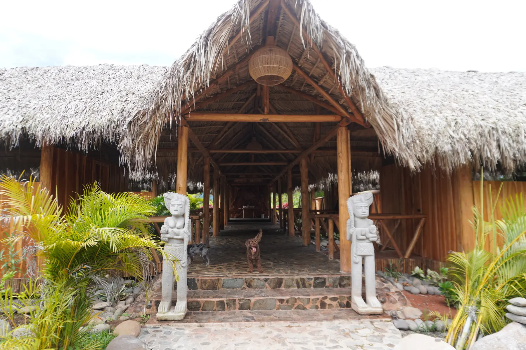 The entrance to the cabins, with stone statues on the steps