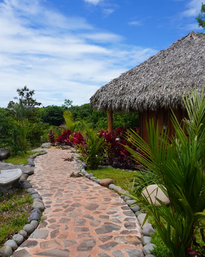 A stone path to a cabin