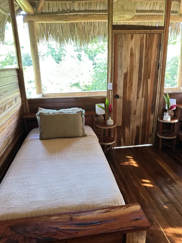 A cabin room, a bed beneath the window