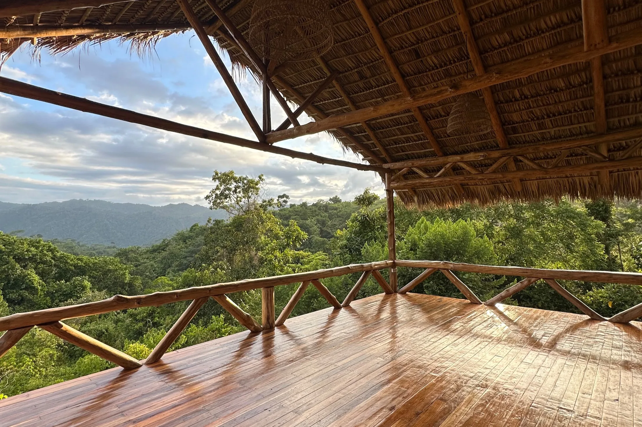 The yoga shala, wooden floor open to the canopy